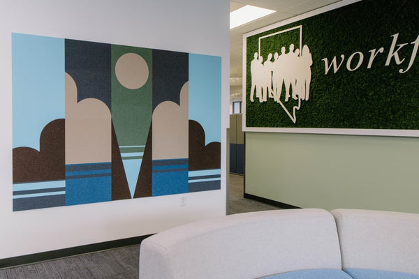 Large mural in cool tones against a white wall with the Nevada Workforce Connections logo in the background