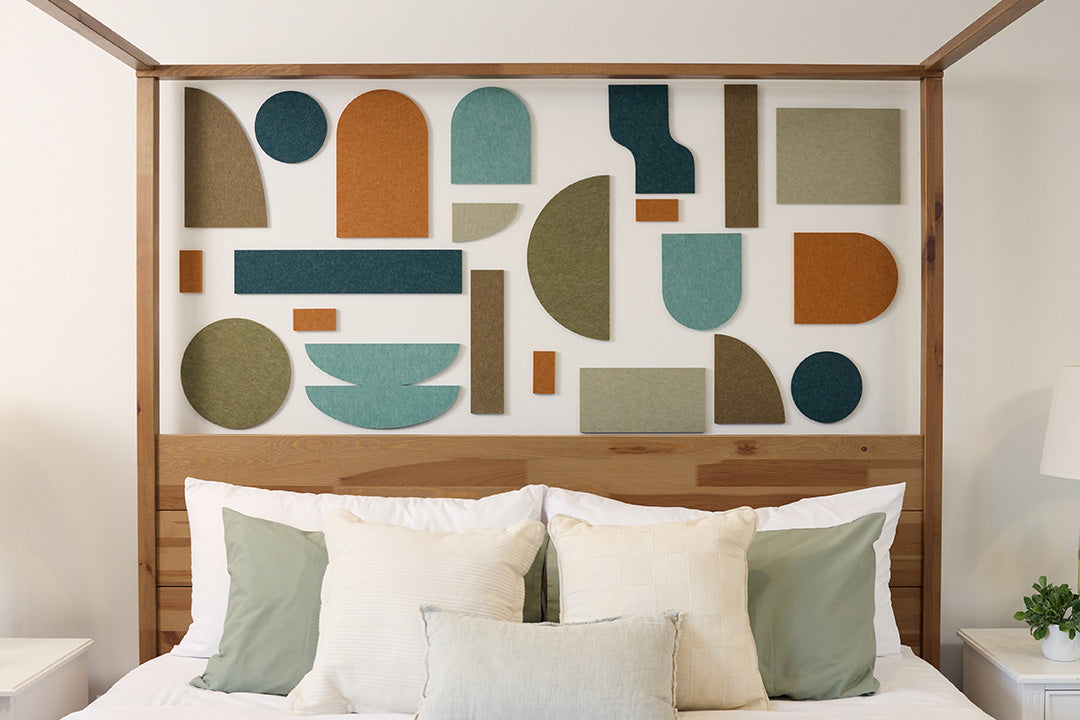 Organic decorative shapes installed on wall behind bed.