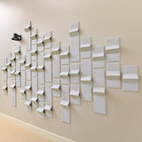 Grey acoustic felt tiles with peak points along a hallway with a light
