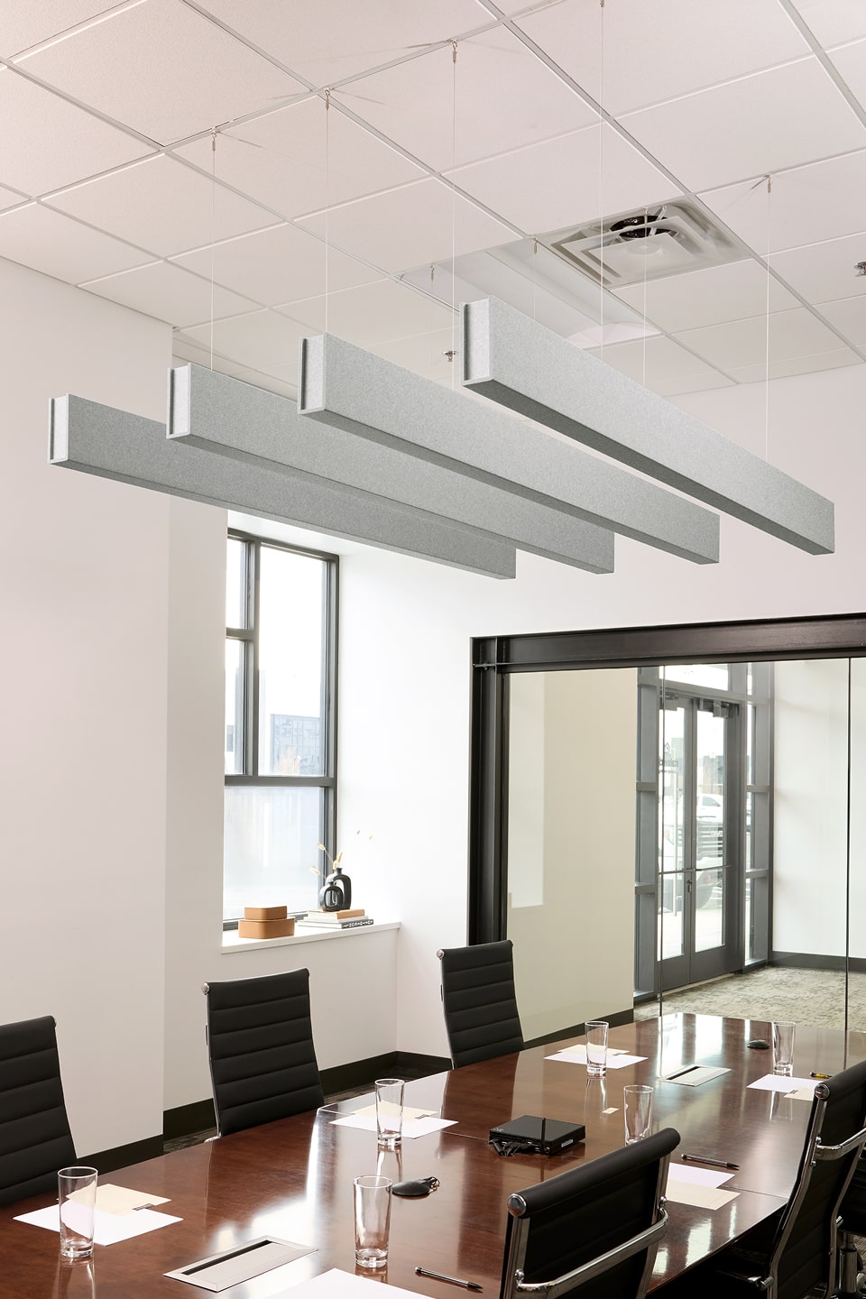PET felt suspended acoustic beam in Nickel by Felt Right absorbs unwanted noise and looks great in any setting. Available in four or eight foot lengths. Clips into ACT grid or drills into drywall ceiling.