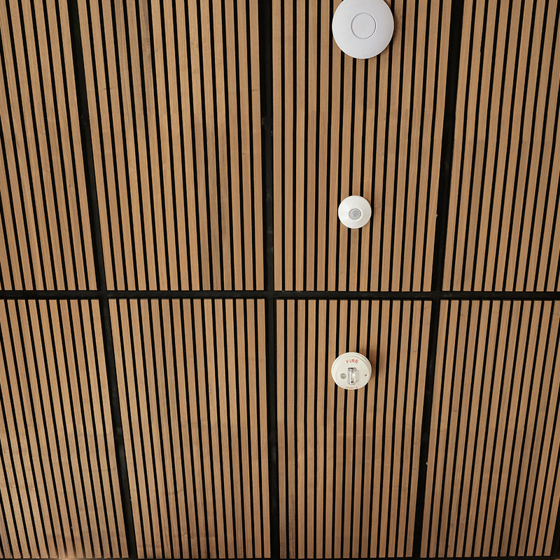 Close-up of wood ceiling panels
 with brown and black striped pattern