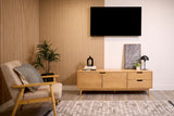 Modern living room with wooden furniture, TV, and wood wall paneling