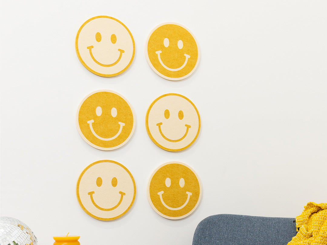 6 Smiley Face Decals on a Wall