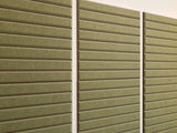 Three large parallel panels with horizontal olive and cocoa striped pattern.