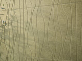 Textured green surface with wavy patterns