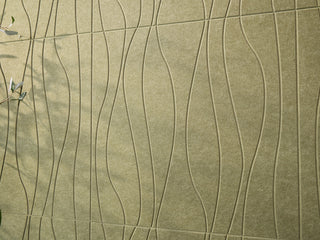 Textured green surface with wavy patterns