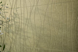 Textured green acoustic wall panels with wavy patterns and leaves on the side