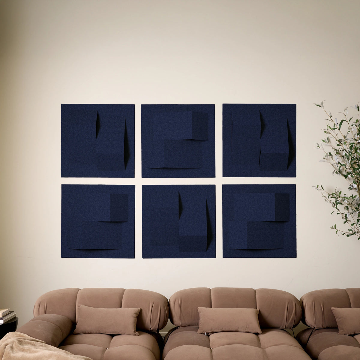 Dark blue decorative acoustic felt panels creating dimensional sound absorbing wall art