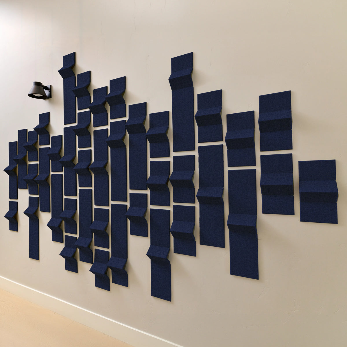Dark blue acoustic felt wall tiles with peak points of dimension 