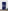 Navy blue room divider with white dot pattern in a minimalistic room.