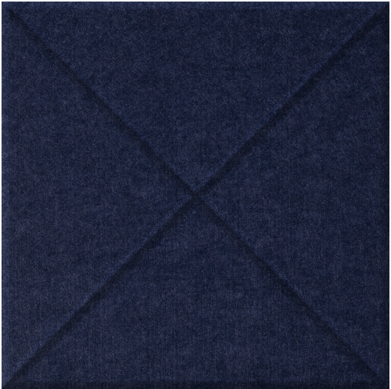 Dark blue tile with raised cross pattern and textured surface.