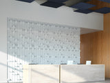 Modern interior with a reception desk and textured wall, features Peak Dimensional Tiles from Felt Right