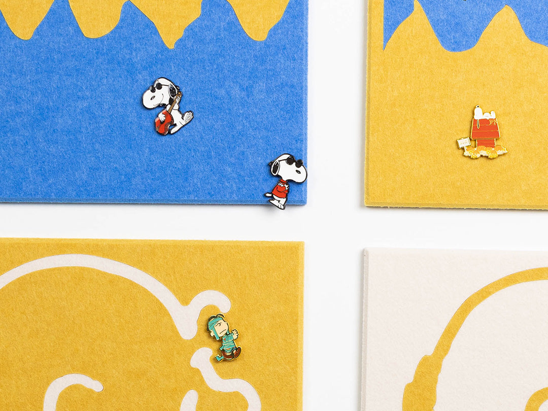 Close up Peanuts wall panels with pins in them.