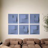 Purple-blue acoustic felt wall tiles arranged in a 3D design above a sofa