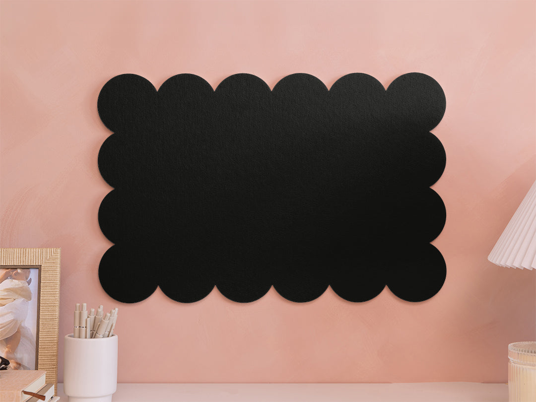 Black cloud-shaped chalkboard on a pink wall