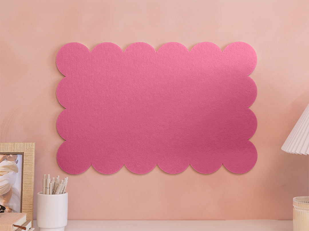 Pink scalloped acoustic panel on a pink wall