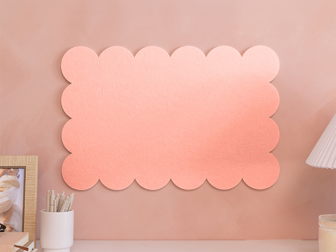 Pink scalloped acoustic panels on a wall