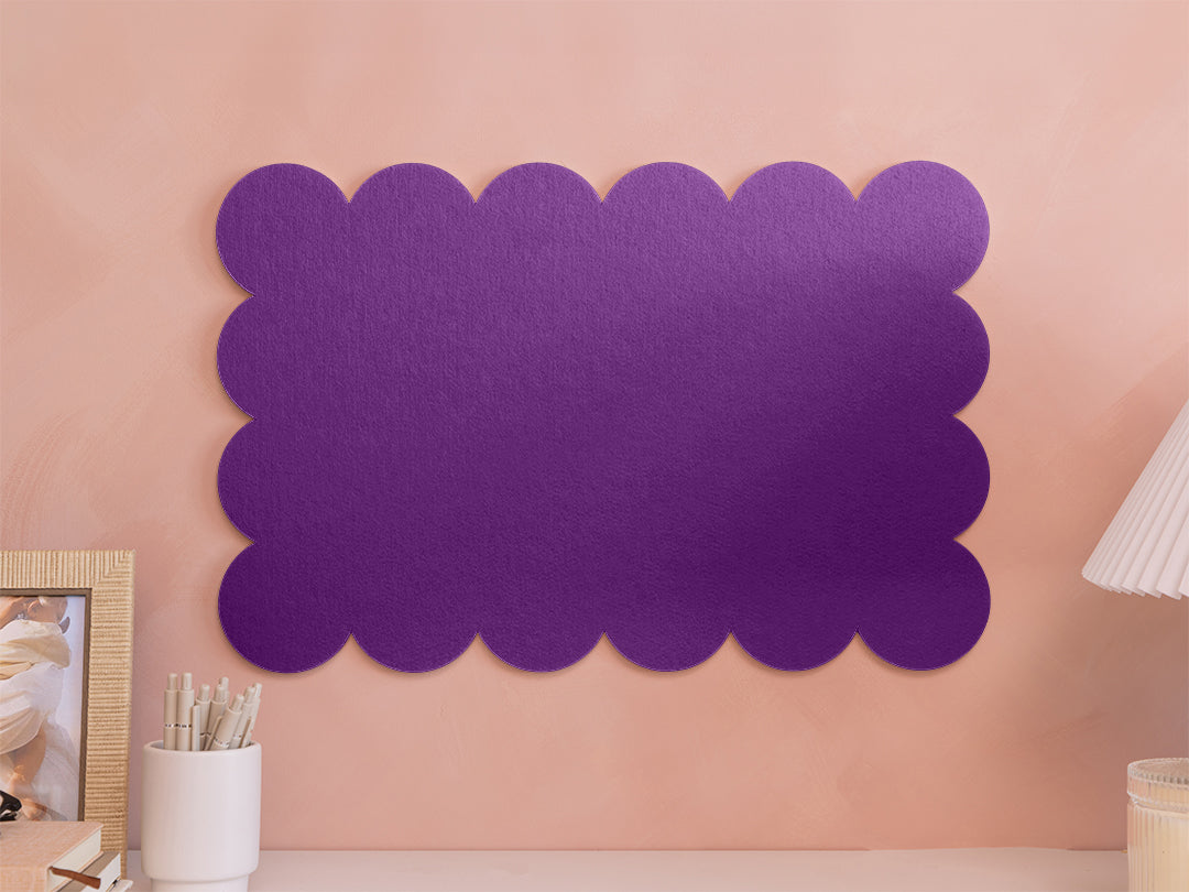 Purple scalloped acoustic panel on a pink wall