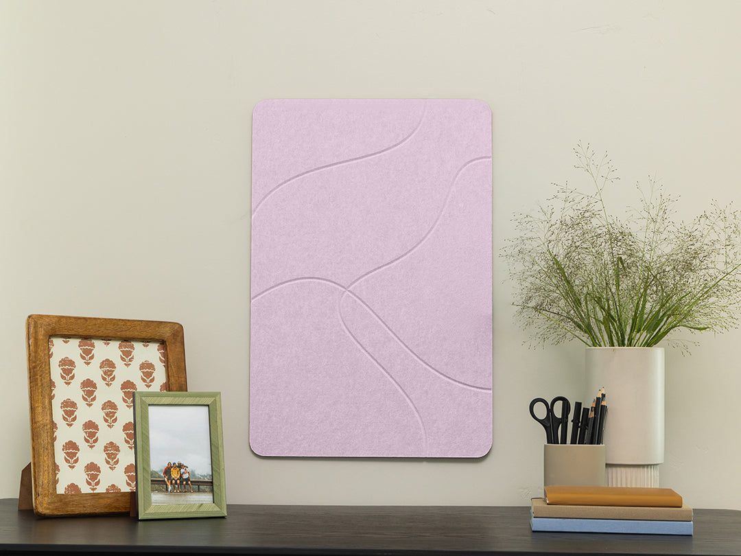 Purple wall art panel on a shelf with decorative items