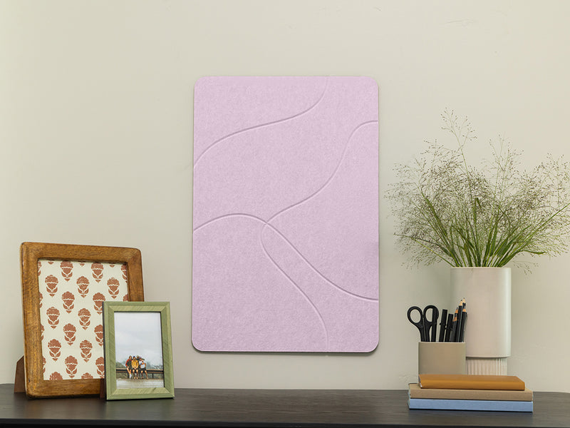 Purple wall art panel on a shelf with decorative items