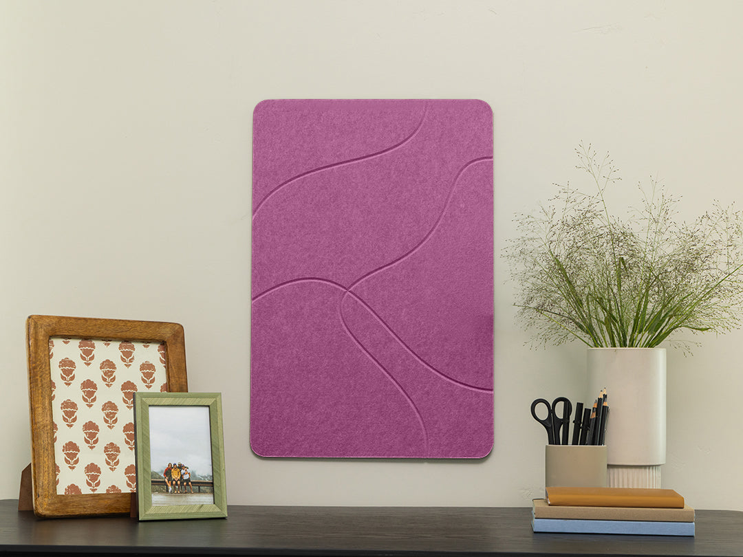 Purple wall art panel on a wall with decorative items below