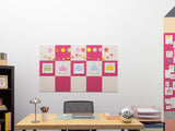 Home office with a desk, chair, and decorative bulletin boards on the wall.