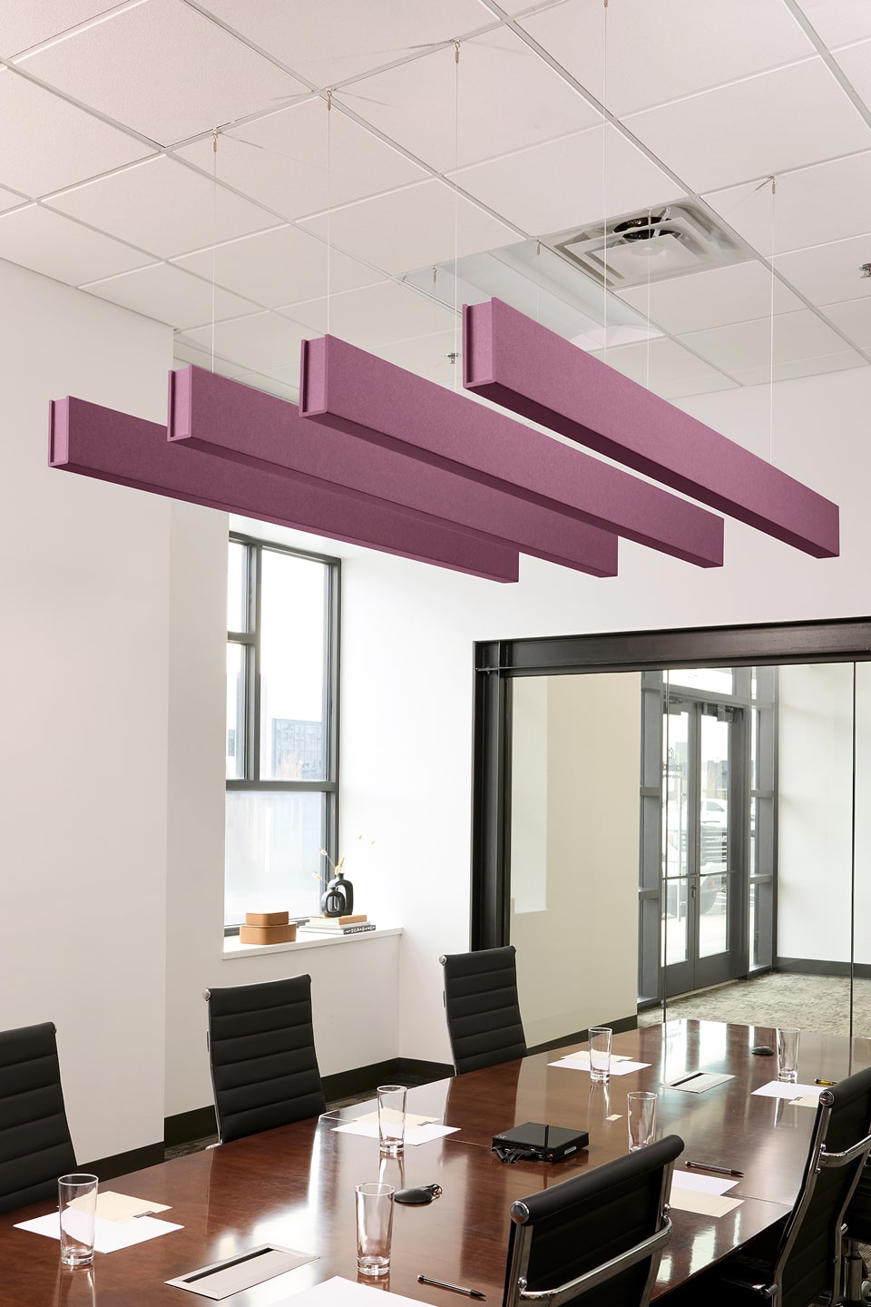 PET felt suspended acoustic beam in Plum by Felt Right absorbs unwanted noise and looks great in any setting. Available in four or eight foot lengths. Clips into ACT grid or drills into drywall ceiling.