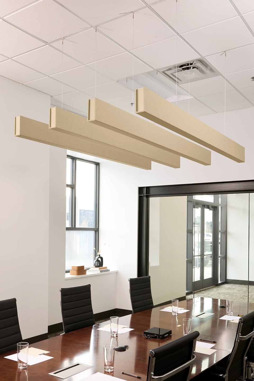 PET felt suspended acoustic beam in Porcelain by Felt Right absorbs unwanted noise and looks great in any setting. Available in four or eight foot lengths. Clips into ACT grid or drills into drywall ceiling.
