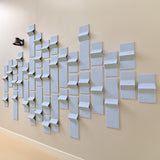 Soft blue felt tiles with peak dimensions creating an acoustic wall