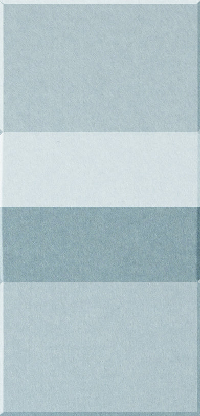 Four rectangular tiles stacked vertically in shades of light blue and white with textured surfaces.