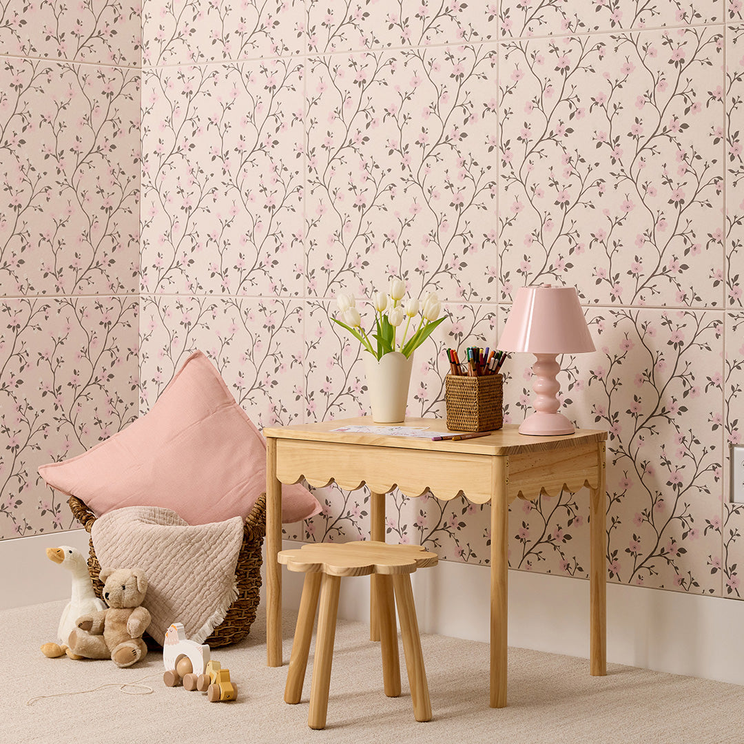Beige tile with repeating pattern of delicate flowering branches in pink, burgundy, and olive tones.
