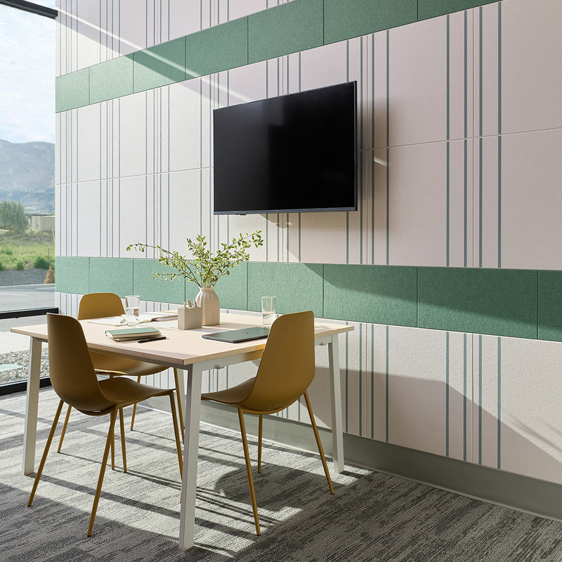 White and green tiles with vertical pinstripe pattern covering office wall behind dining table.