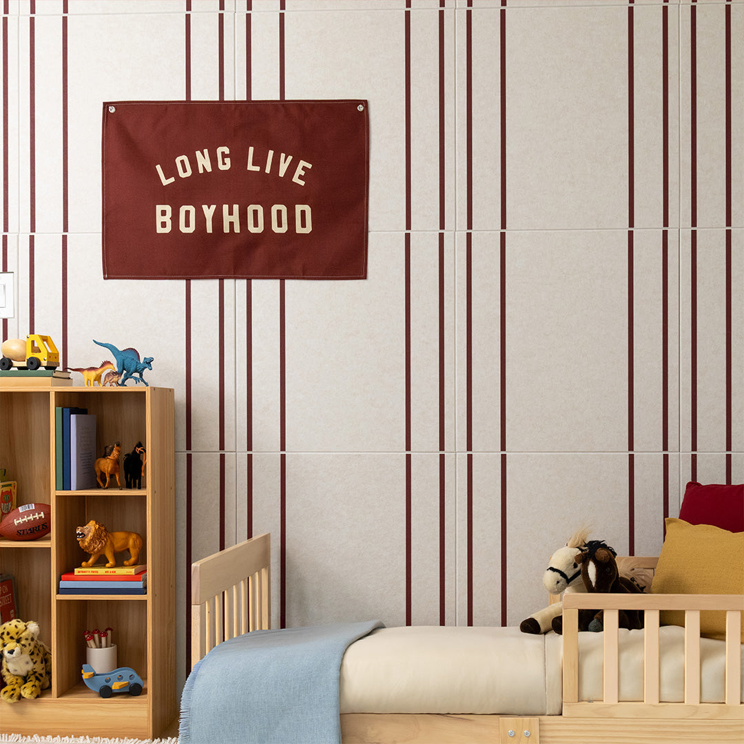 Beige tile with burgundy vertical pinstripes in 9mm width pattern, displayed on bedroom wall.