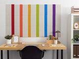 Beige bulletin board with vertical rainbow pinstripes in red, orange, yellow, green, blue, and purple.