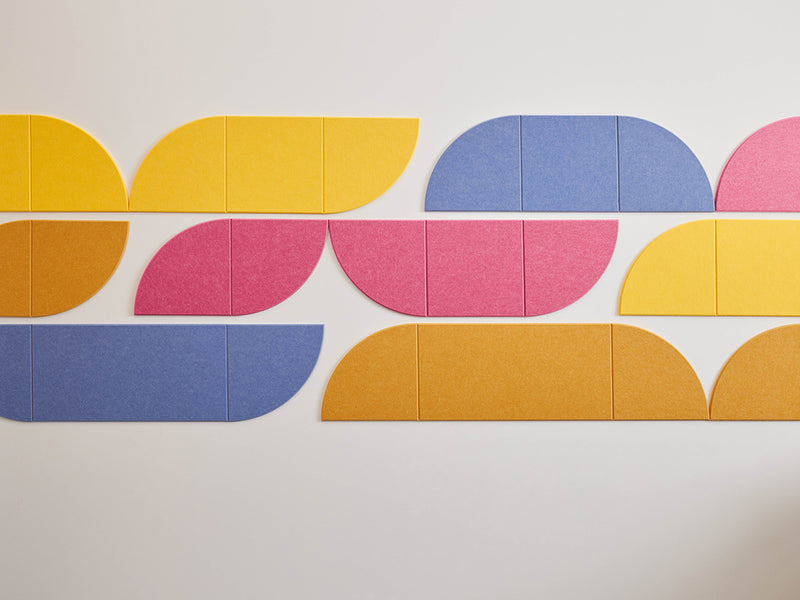 Colorful geometric wall panels on a plain background