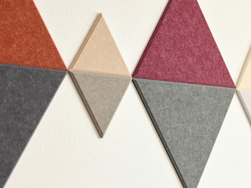 Geometric triangle-shaped tiles in various colors on a white background