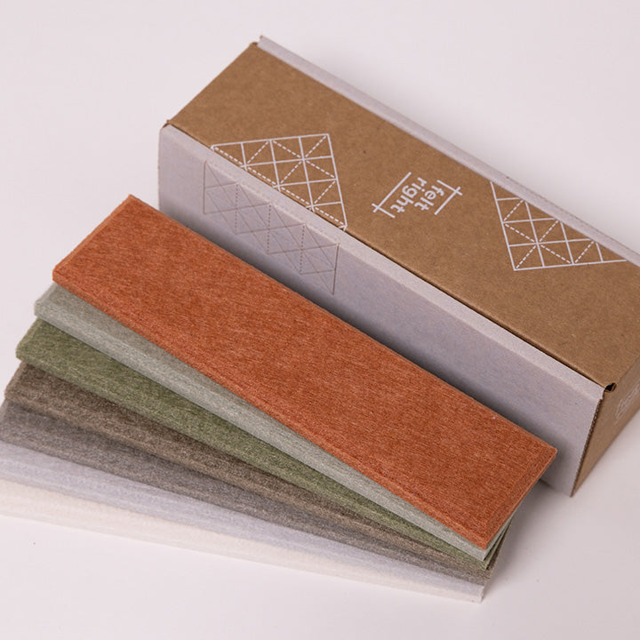 Fall colored felt samples by cardboard box
