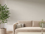 Felt Right tangent design on a Wall covered in Felt engraved tiles in the color sage displayed behind a couch in a living room