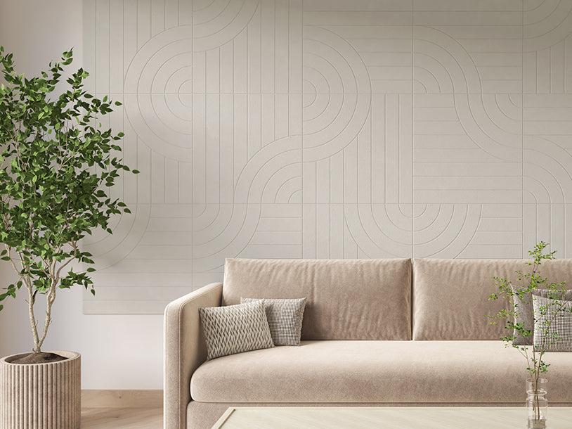 Felt Right tangent design on a Wall covered in Felt engraved tiles in the color sage displayed behind a couch in a living room