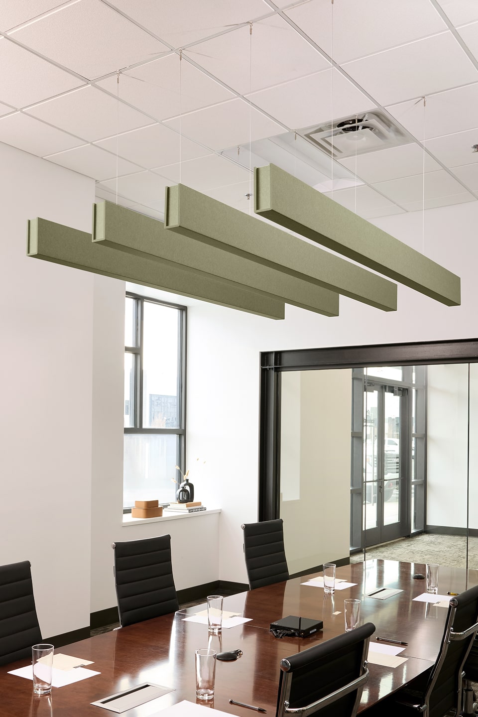 PET felt suspended acoustic beam in Sage by Felt Right absorbs unwanted noise and looks great in any setting. Available in four or eight foot lengths. Clips into ACT grid or drills into drywall ceiling.