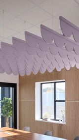 Light purple acoustic ceiling blade baffles suspended from the ceiling, installed in a conference room. Felt Right's acoustic blade baffles absorb 65% of sound waves, making office spaces quieter and feel more calm.