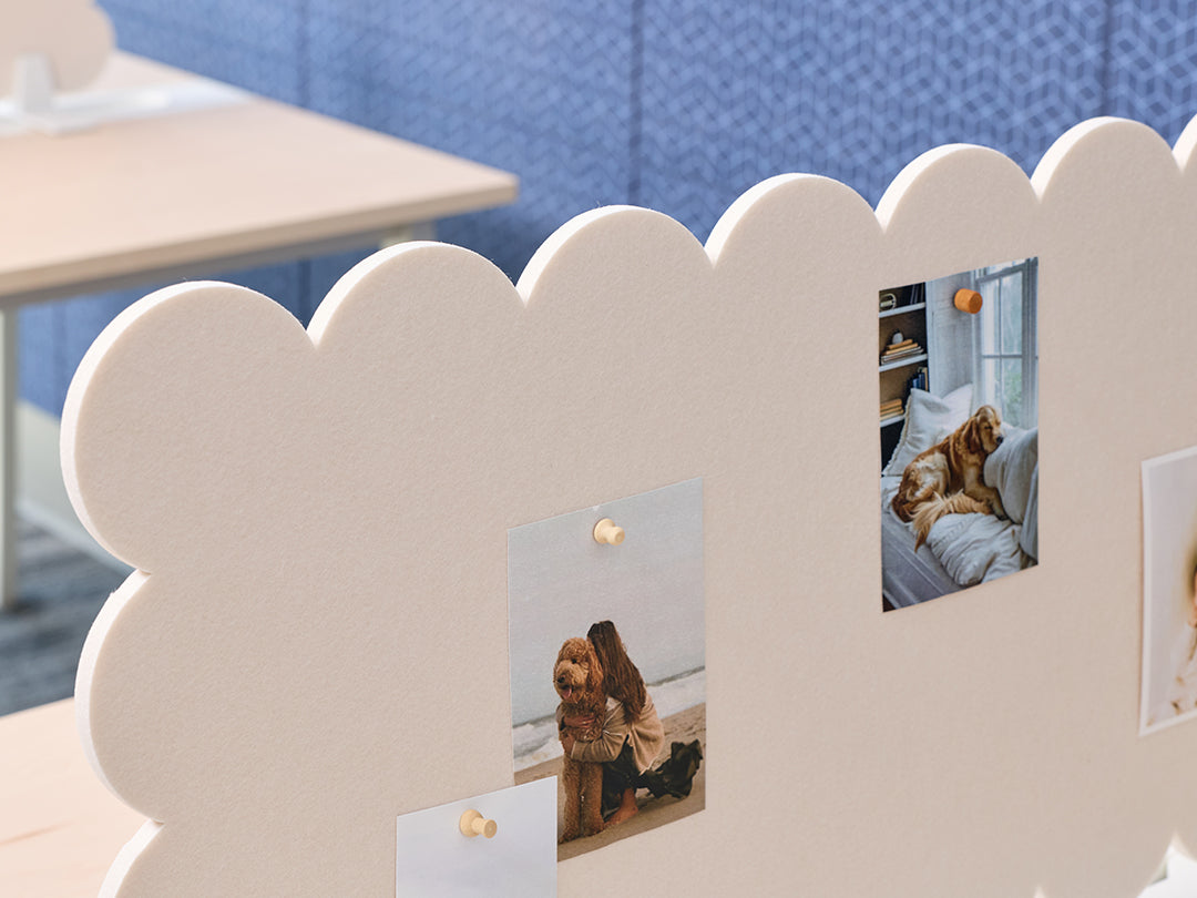 Decorative photo frame with cut-out design holding photos of a person and a dog.