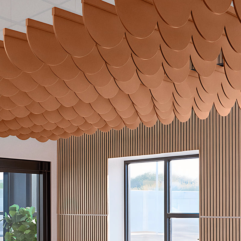 Scallop felt ceiling blades in rust orange above a room with wood slat walls