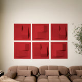 Red acoustic felt tiles on a wall with a modern design above a couch