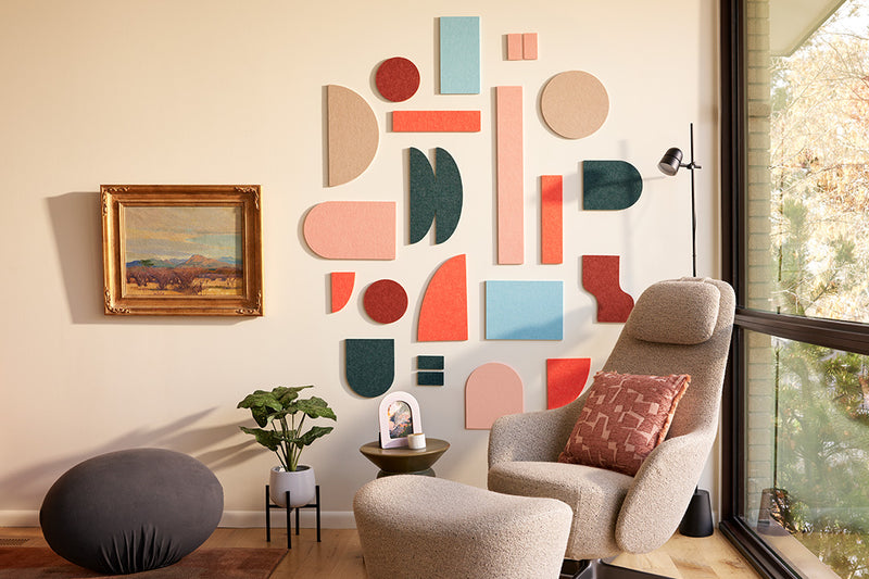 Bright Felt Right tiles installed on wall behind armchair. 