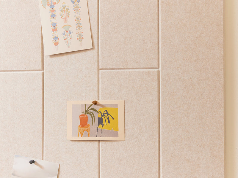 felt right cream tiles in the shiplap patter with cards pinned onto the felt tiles