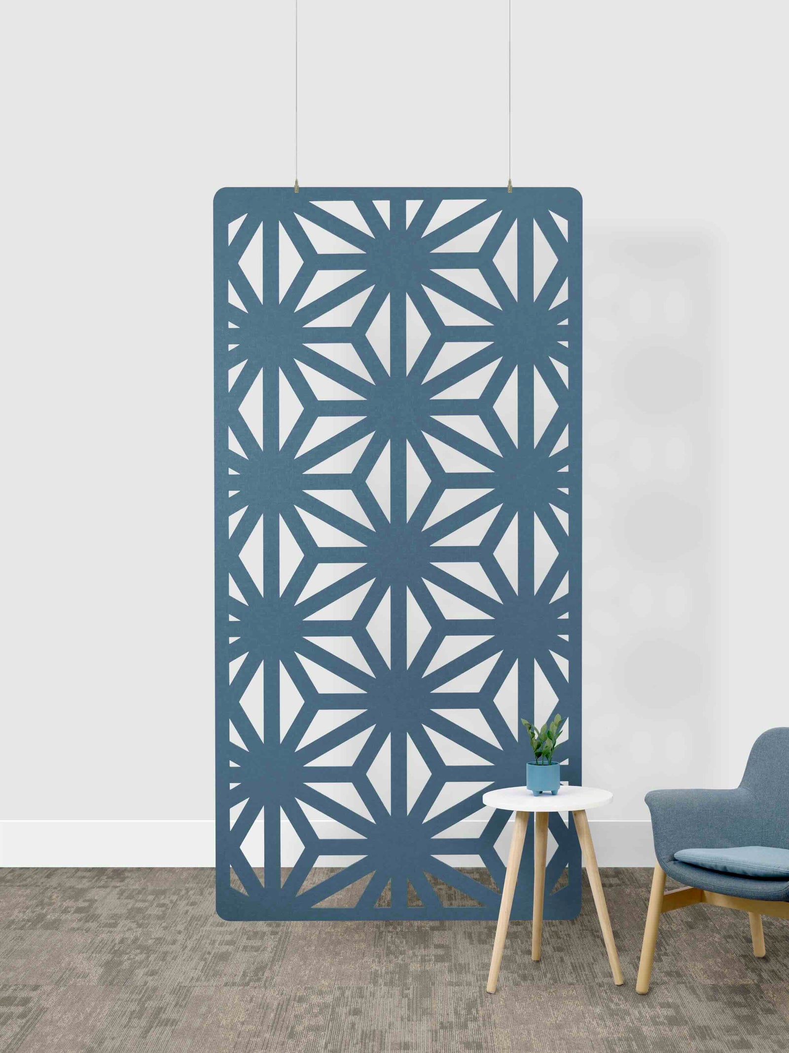 Decorative screen with geometric pattern in a room setting