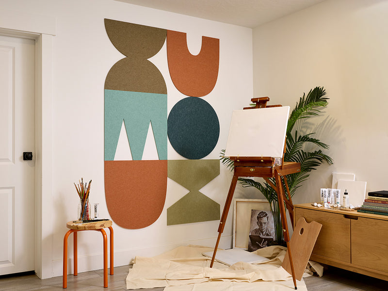 Modern interior with abstract acoustic wall art and wooden furniture