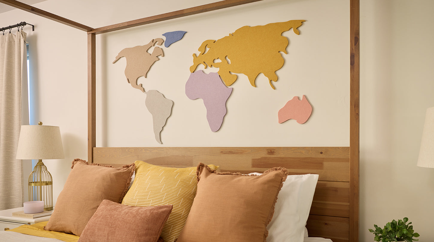 World map above bed on wall
