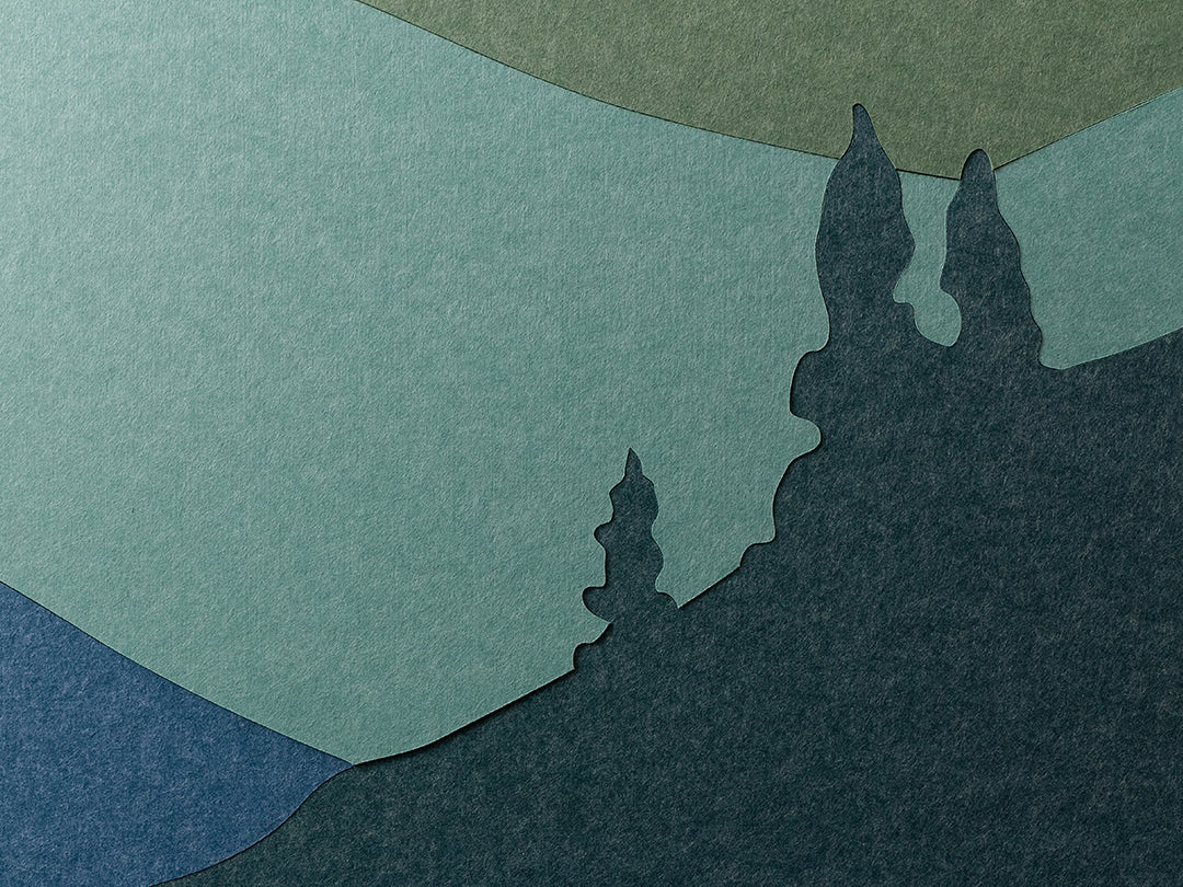 Silhouette of a tree on a textured green and blue background
